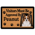 Papillon dog doormat with paw prints, tan textured background, black border, and welcoming entryway message