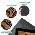 Papillon dog doormat feature view showing the textured printed surface and dark rubber backing