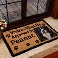 Bernese Mountain Dog doormat styled inside a home near a glass door and neutral entryway decor