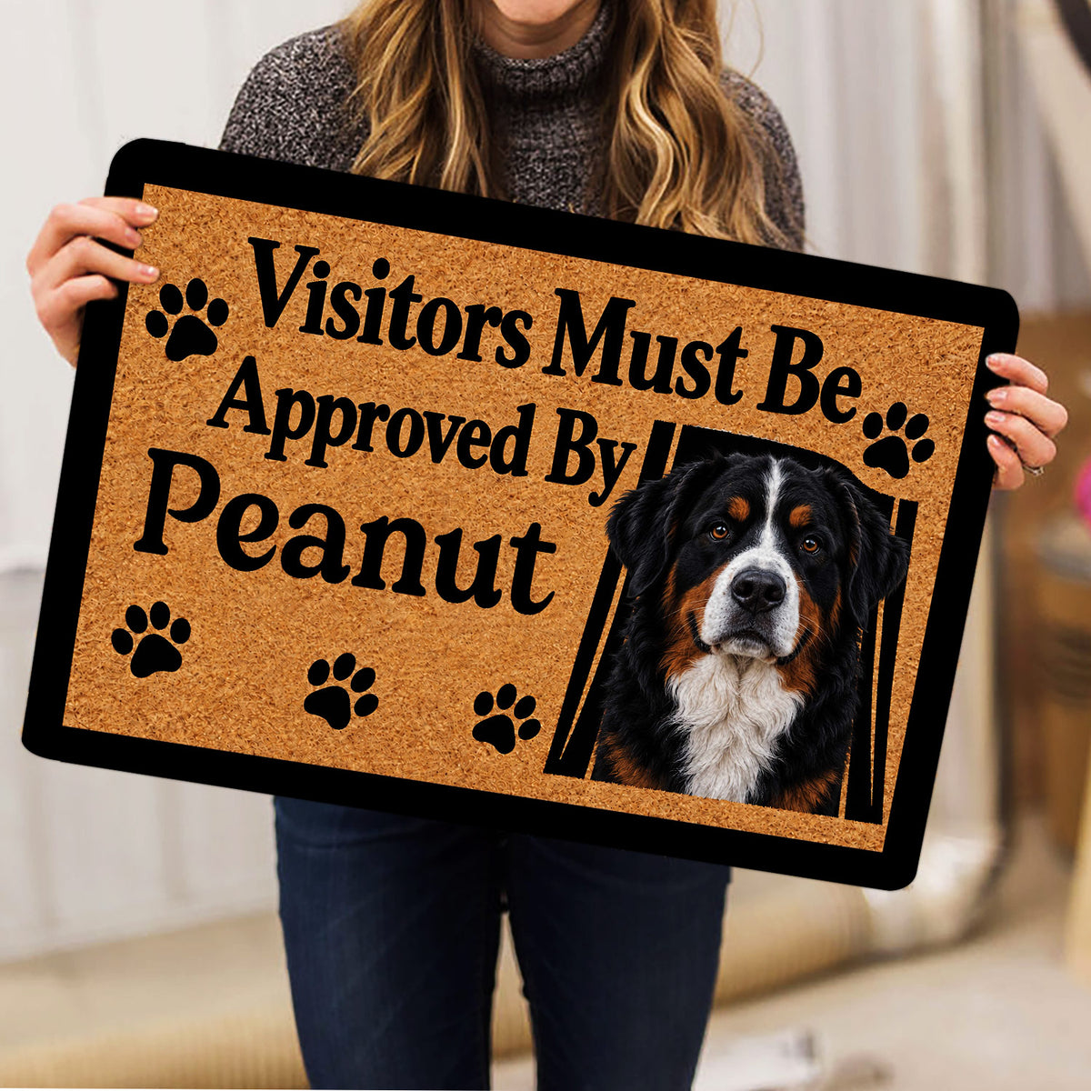 Bernese Mountain Dog doormat held indoors, showing the full portrait, paw prints and visitor message
