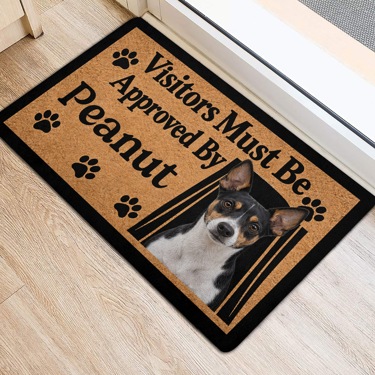 Rat Terrier entryway mat on a light wood floor featuring a dog portrait and black paw prints