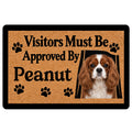 Cavalier King Charles Spaniel doormat with paw prints and a humorous visitor-approved entryway message
