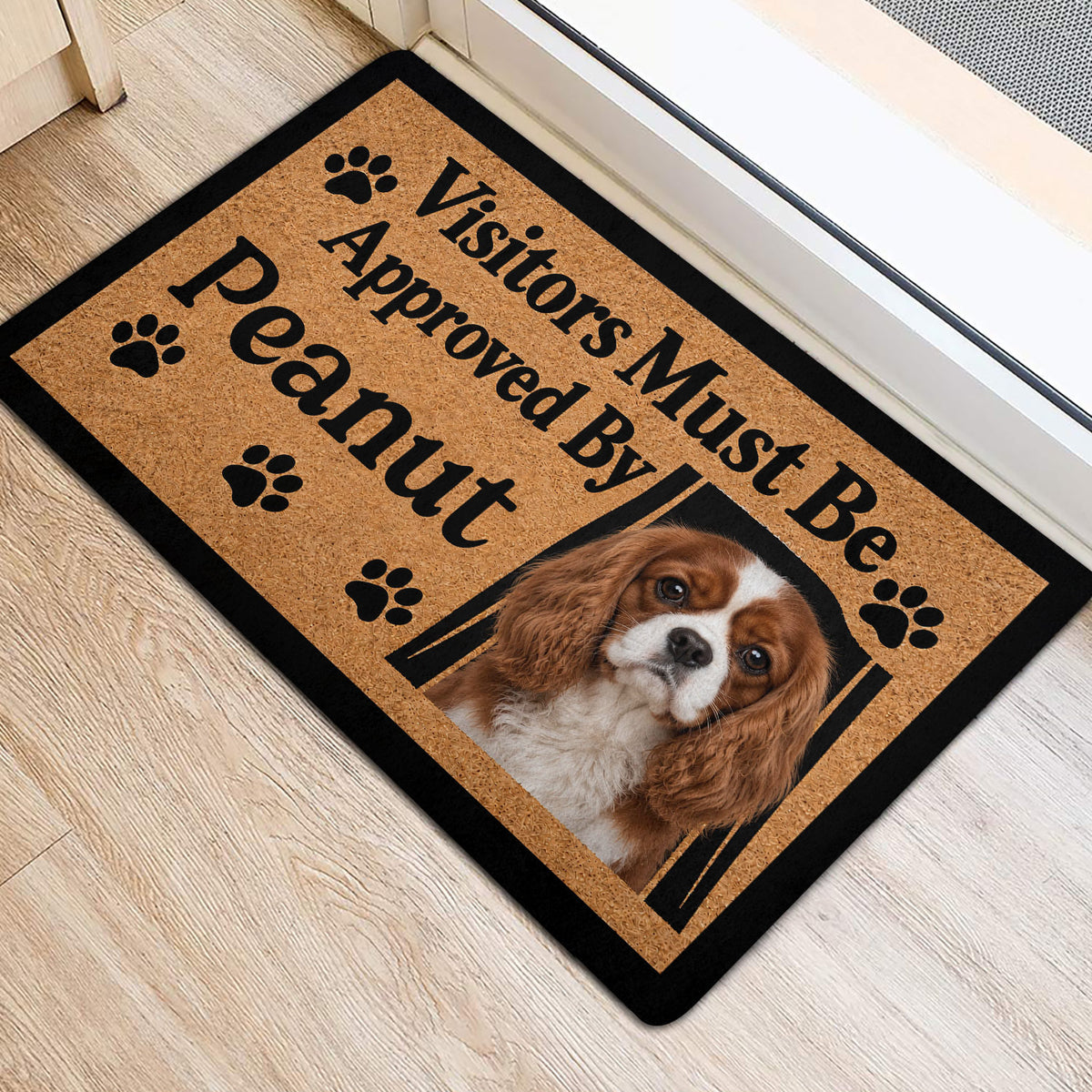 Cavalier King Charles entryway mat with framed dog portrait, paw prints and bold black lettering