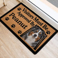 Australian Shepherd entryway mat beside a doorway with paw prints and bold black lettering