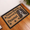 English Springer Spaniel doormat styled by a front door on a warm wood floor