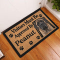 English Mastiff doormat displayed inside a home by a white door on a warm wood floor