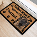 English Mastiff entryway mat with paw prints and tan artwork positioned beside an interior doorway