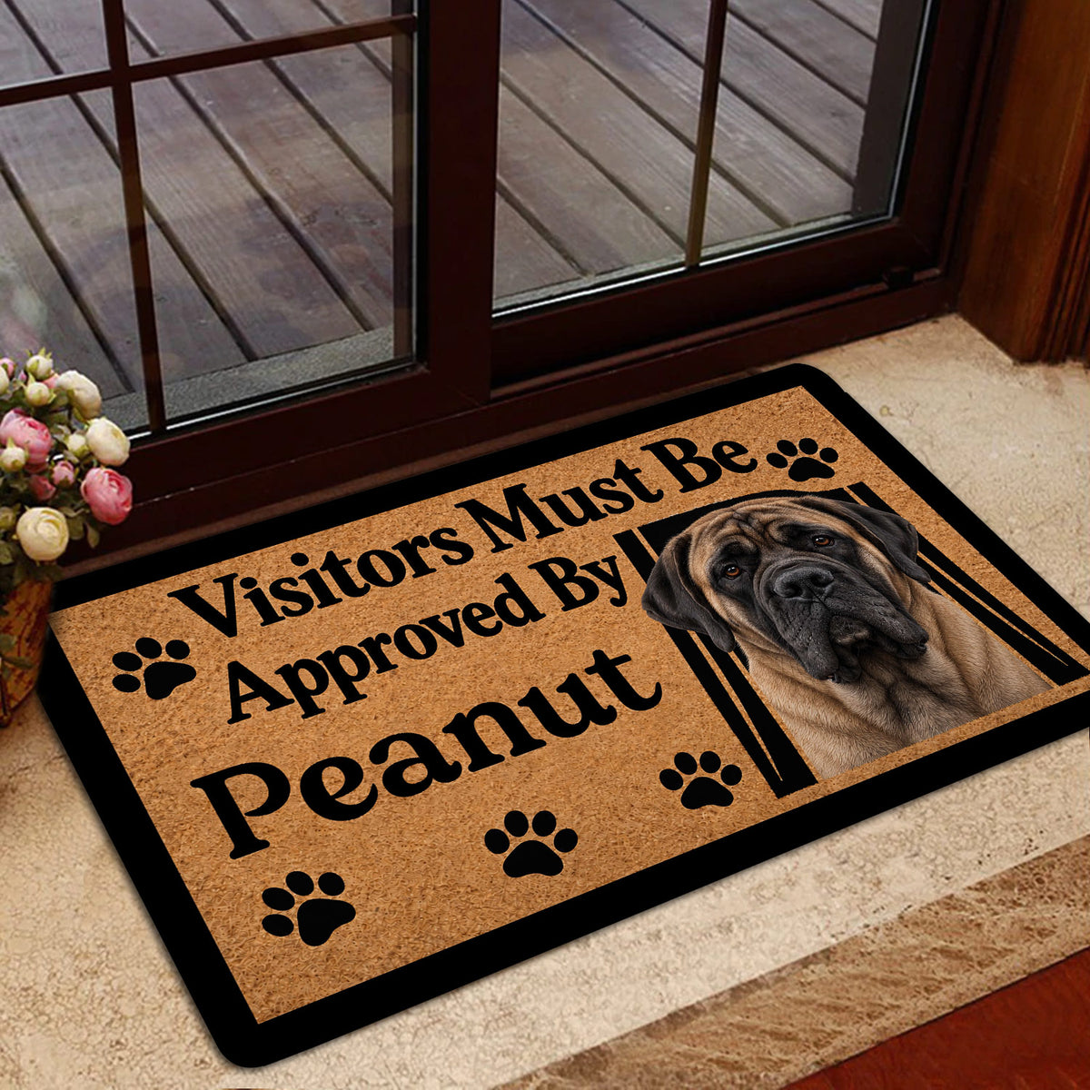 Mastiff welcome mat shown near a glass entry door with a warm home decor setting