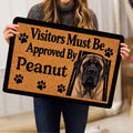 English Mastiff doormat held indoors, showing the realistic dog portrait, paw prints and tan artwork