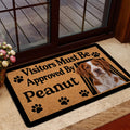 Brittany Spaniel entryway rug displayed by a glass door with warm home decor surroundings