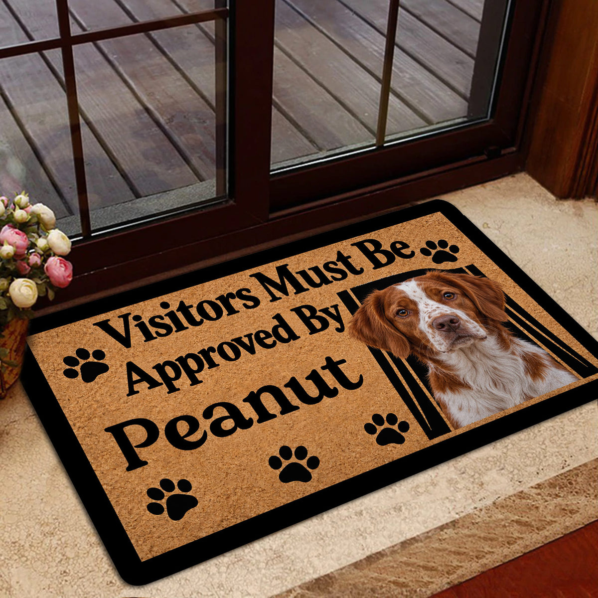 Brittany Spaniel entryway rug displayed by a glass door with warm home decor surroundings