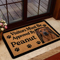 Rhodesian Ridgeback welcome mat styled near a glass door in a home entryway