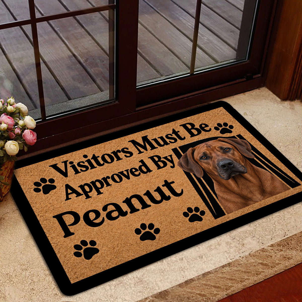 Rhodesian Ridgeback welcome mat styled near a glass door in a home entryway