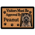 Cairn Terrier doormat with paw prints, portrait artwork, and a humorous visitor approval message
