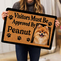 Person holding a Pomeranian doormat featuring a fluffy dog portrait, paw prints and welcome artwork