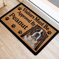 Saint Bernard door mat placed at an entryway with paw prints and bold black lettering