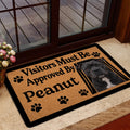 Staffordshire Bull Terrier door mat placed inside a glass doorway with bold tan and black design