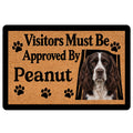 English Springer Spaniel doormat with paw prints, warm tan artwork, black border, and welcoming text