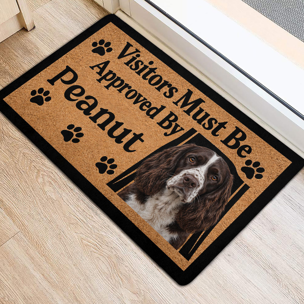 English Springer Spaniel entryway rug with paw prints and welcoming typography beside a doorway
