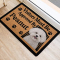 Bichon Frise front door mat featuring a smiling white dog portrait, paw prints, and black border