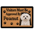 Maltese dog doormat with paw prints, warm tan background, black border, and playful entryway message