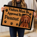 Vizsla dog doormat held indoors showing a realistic dog portrait, paw prints, and bold welcoming typography