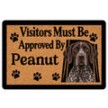 German Shorthaired Pointer doormat with paw prints, warm tan artwork, black border, and bold welcome message