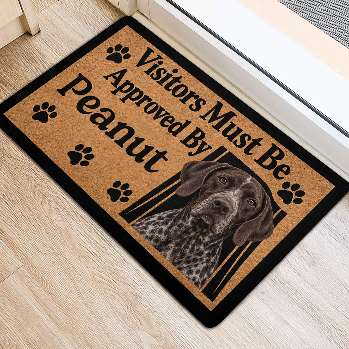 German Shorthaired Pointer entryway mat on a light wood floor, featuring paw prints and a dog portrait