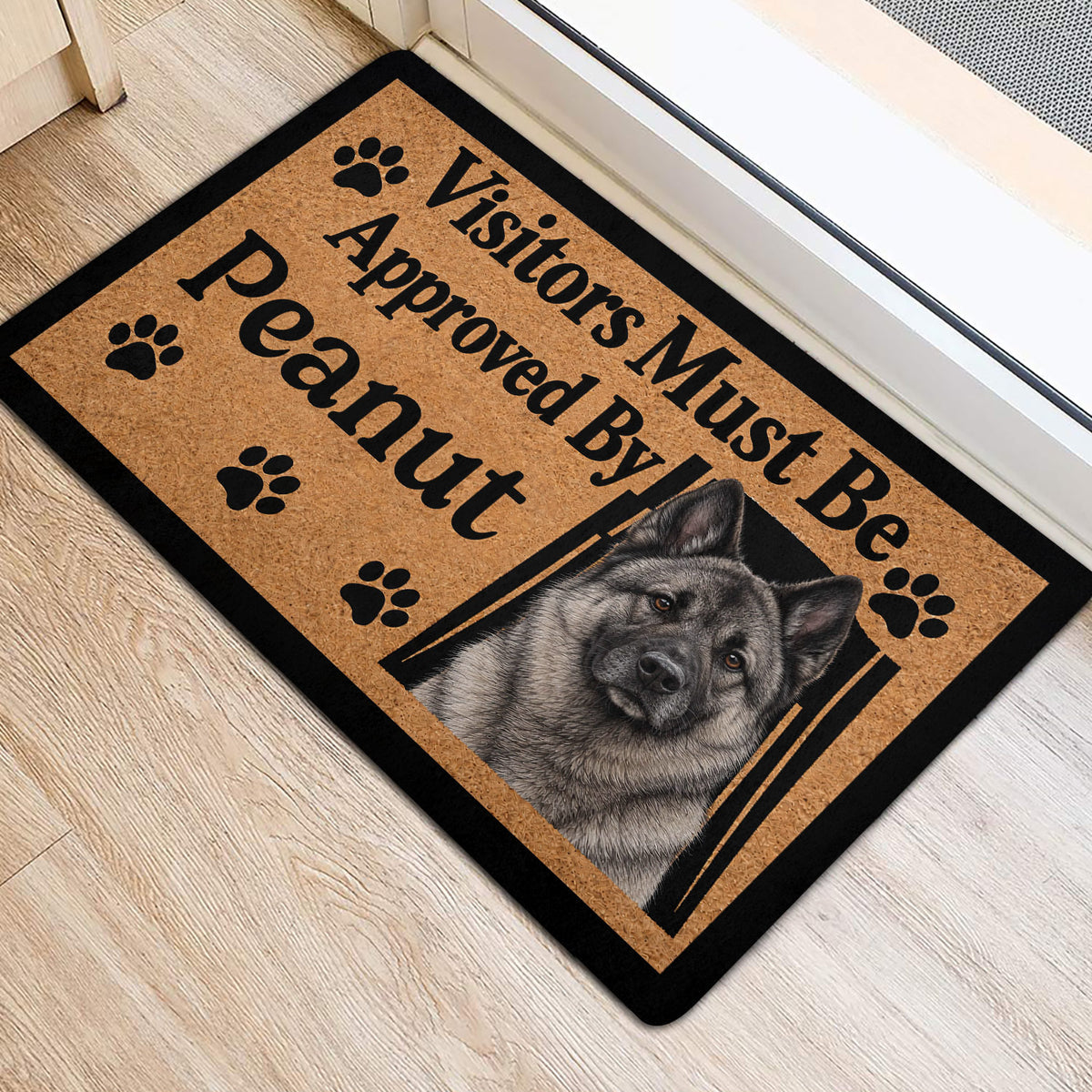 Norwegian Elkhound entryway mat displayed near a doorway with paw prints and bold black lettering