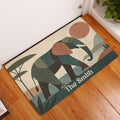 Geometric elephant entryway rug displayed beside a white door on a warm wood floor