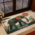 Decorative elephant doormat styled in a home entrance near a glass door and indoor plants