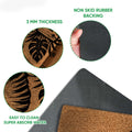 Elephant doormat feature view showing printed surface, rubber backing, traction, and easy-clean details