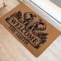 Elephant welcome door mat shown beside a doorway with botanical leaf artwork