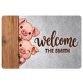 Playful pink pig doormat design with a wood door graphic and welcoming entryway artwork