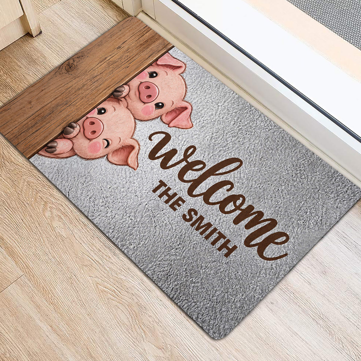Pig-themed entryway rug shown beneath a doorway with playful illustrated pig artwork