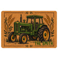 Vintage-style green tractor doormat with wheat stalks, grassy details, and a rustic tan background