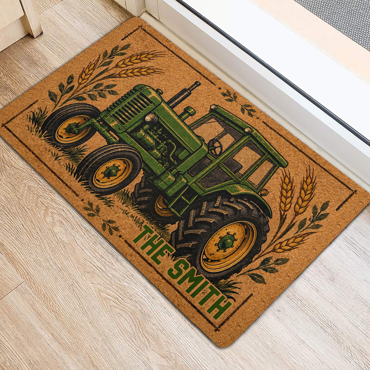 Tractor-themed front door mat with wheat and leafy accents shown on a light wood floor