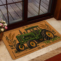 Rustic green tractor doormat styled at a glass entry door with farm-inspired artwork