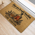 Rustic bourbon-themed door mat with bottle, whiskey glass and wheat artwork beside an entry door