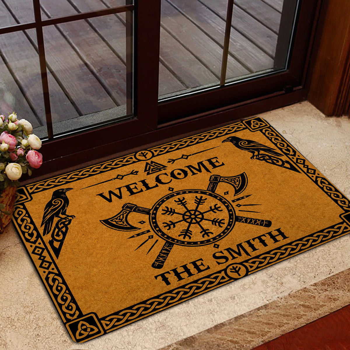 Viking doormat styled in a home entrance beside a glass door with a Norse-inspired design