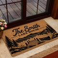 Lake house doormat styled at a glass entry door with a dock, canoe, trees, and mountain scene