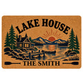 Lake house doormat featuring a cabin, mountain lake, canoe, evergreen trees and paddle artwork