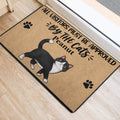 Black-and-white tuxedo cat entryway mat shown near a doorway on a light wood floor