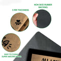 Close-up of the cat doormat showing its printed felt surface, rubber backing, and slim profile
