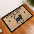 Black cat doormat displayed in a bright entryway beside a white door and wood floor