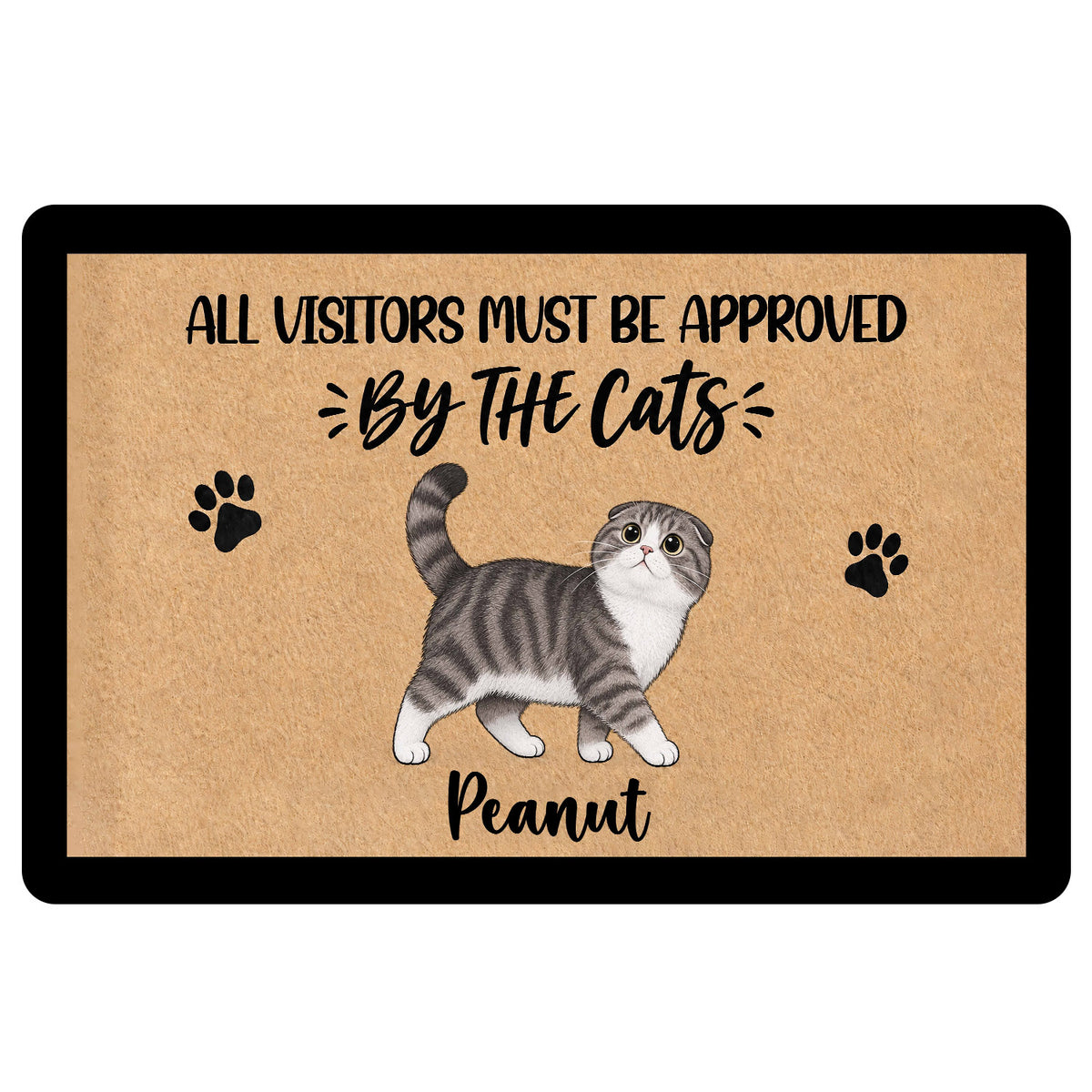 Scottish Fold cat doormat with paw prints and playful visitor approval artwork on a tan surface