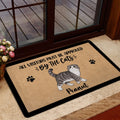 Scottish Fold cat doormat shown at an indoor entrance beside a glass door