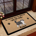 Exotic Shorthair cat door mat styled near a glass entry door with paw print artwork