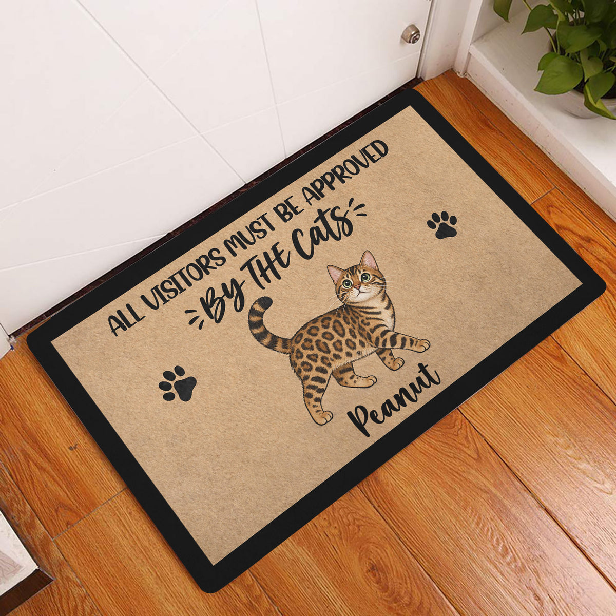 Bengal cat doormat displayed by a white door on a warm wood floor in an entryway