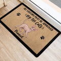 Sphynx cat welcome mat positioned near a doorway on light wood flooring